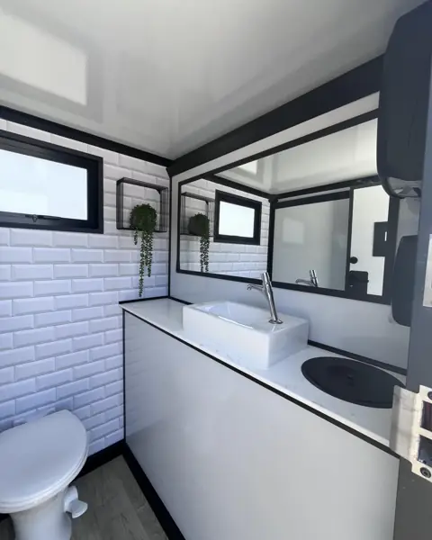 Restroom trailer vanity and window