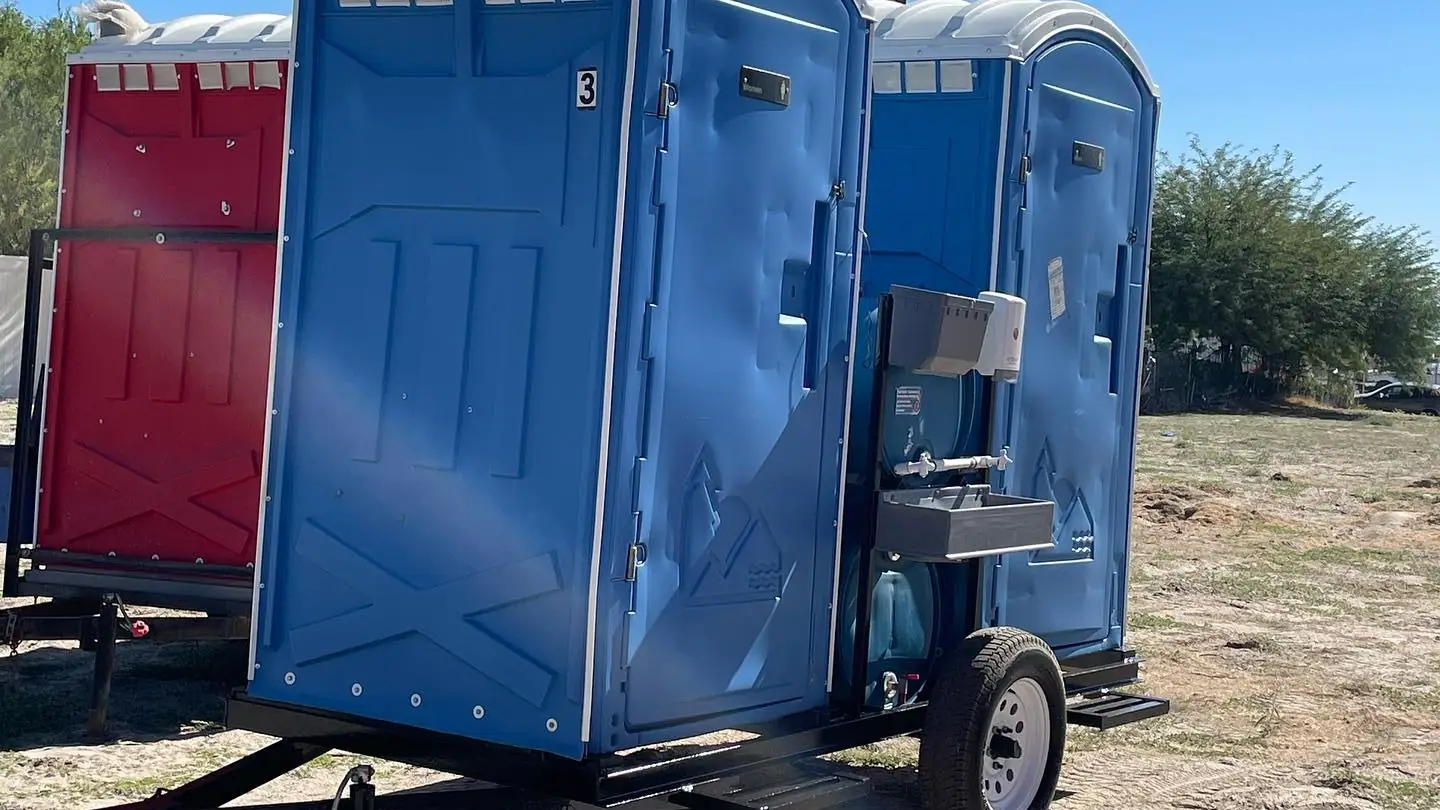 Trailer-mounted porta potties