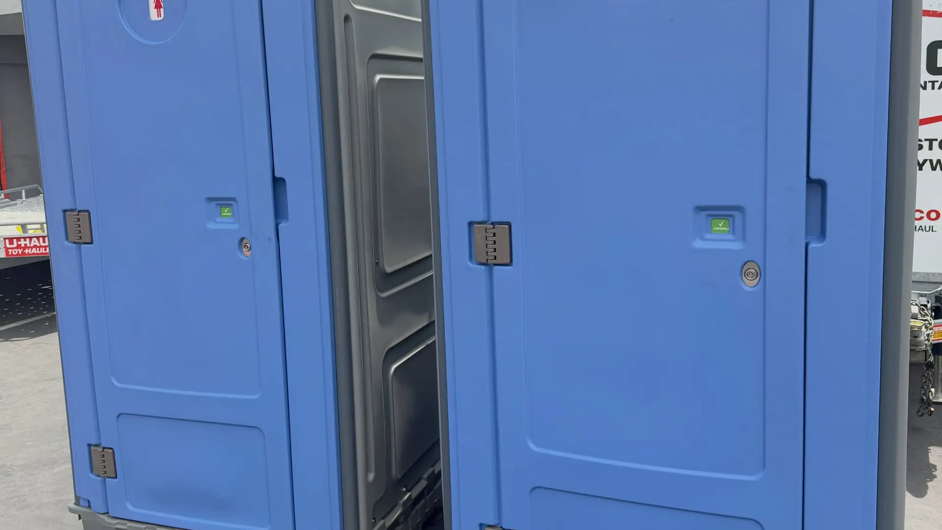 Two blue standard porta potties