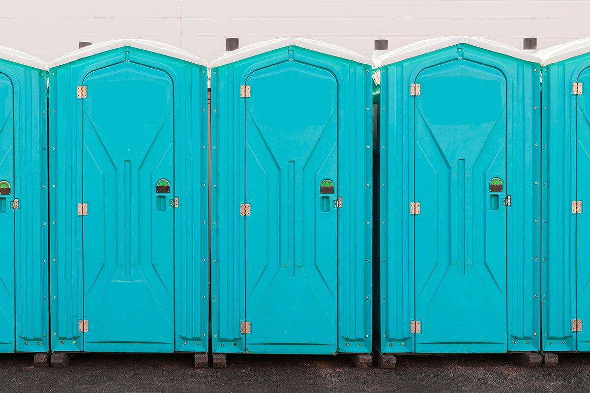 Industrial portable restroom units at a plant in Rowlett, Texas